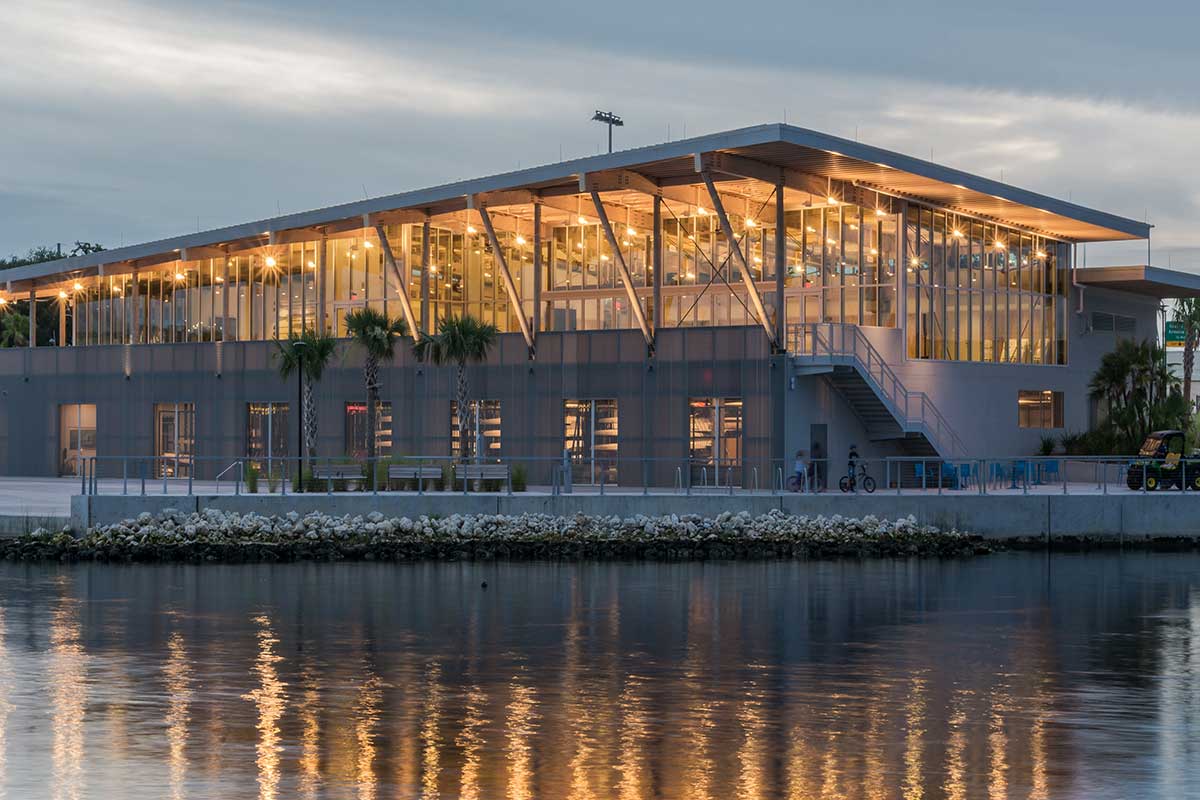 The Bob Buckhorn Tampa River Center at dusk, glowing across the water